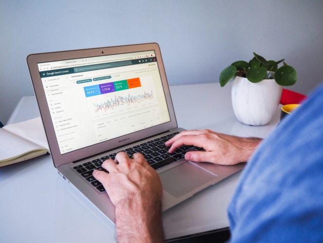 Person with Google Search Console displayed on screen