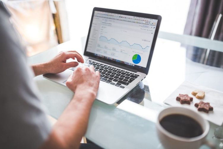 Person sitting infront of Google Analytics